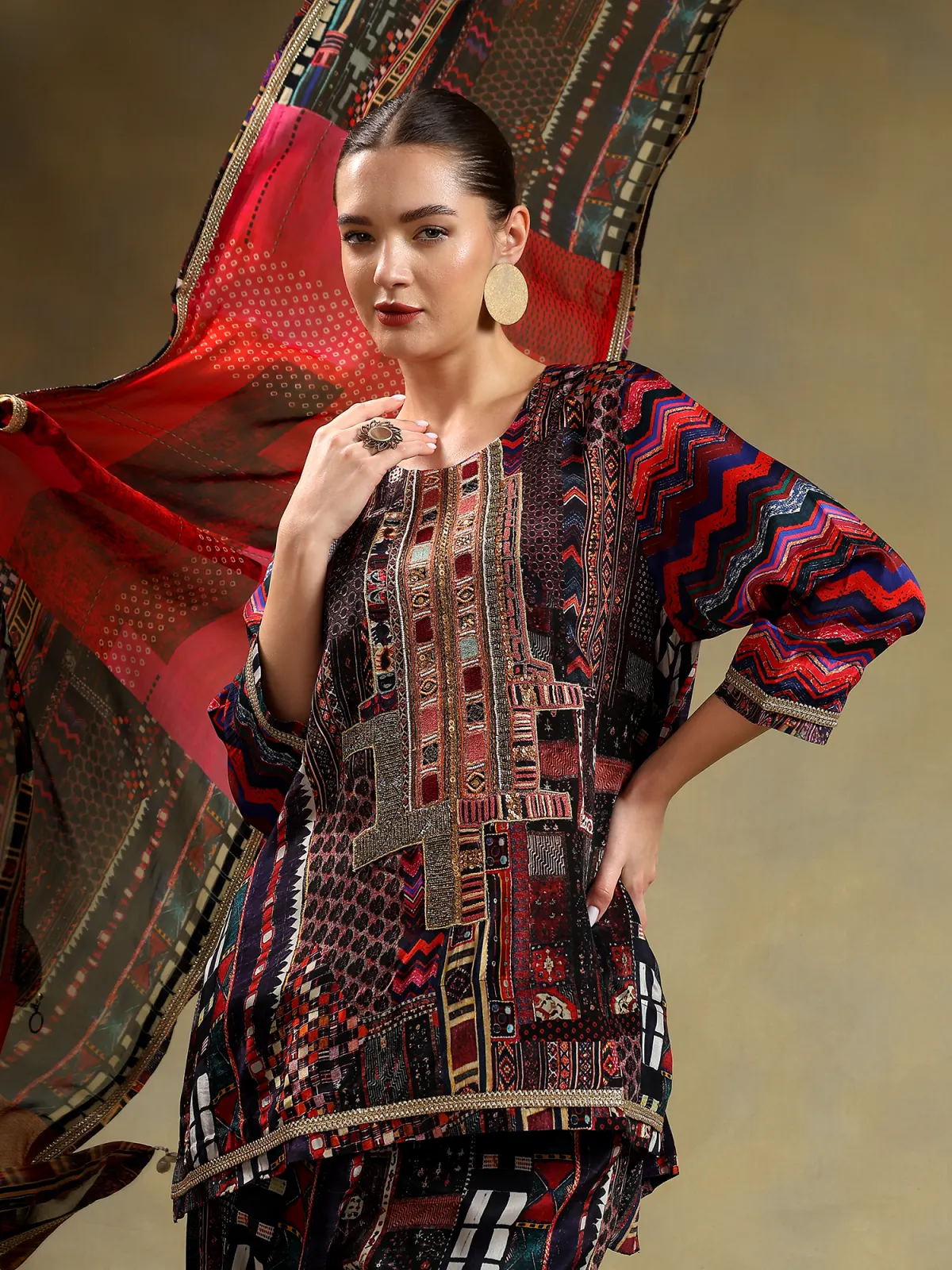 Maximalist embroidered kurta with red dupatta