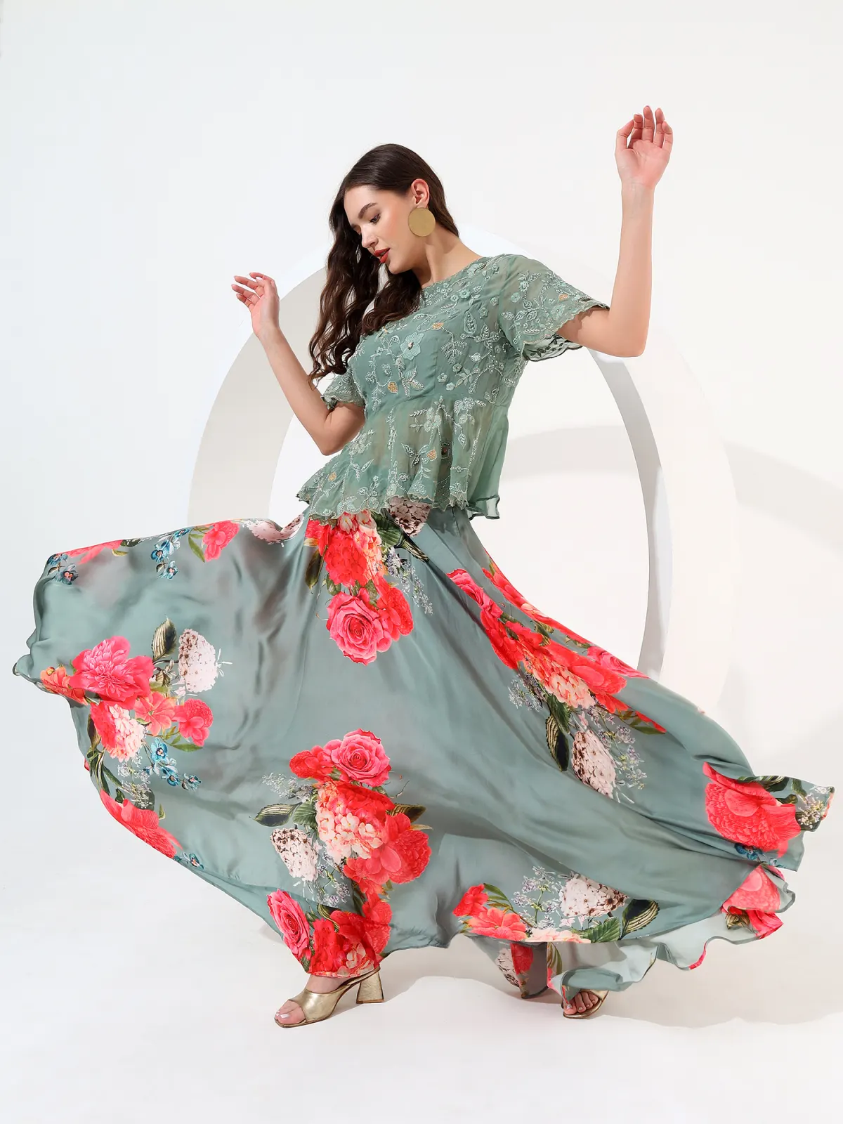 Sage floral skirt in motion, embroidered peplum top